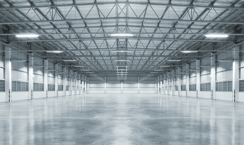 Industrial building or modern factory for manufacturing production plant or large warehouse